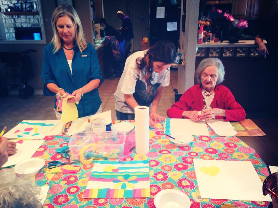 A family enjoying a crafting session together at home.
