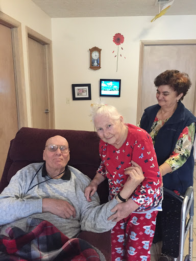 A warm moment among family in a cozy indoor setting, showcasing love and care.