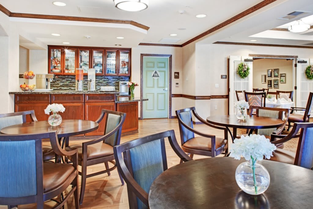 A cozy lounge interior with seating and a bar area.