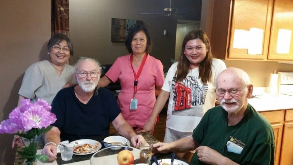 A group of people enjoying a meal together indoors.