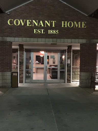 The entrance of Covenant Home, established in 1885, illuminated at night.