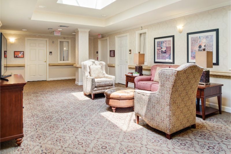 A cozy lobby area with comfortable chairs and soft lighting.