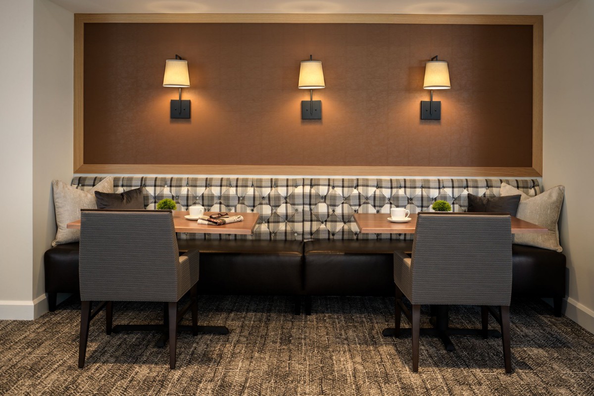 A modern restaurant dining area with stylish seating and table settings.
