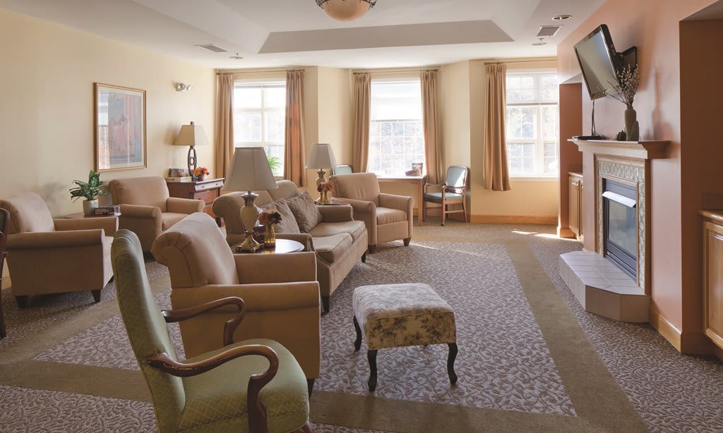 A cozy living room with comfortable seating and natural lighting.