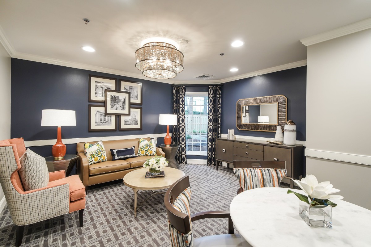 A stylishly decorated living room featuring modern furniture and elegant lighting.