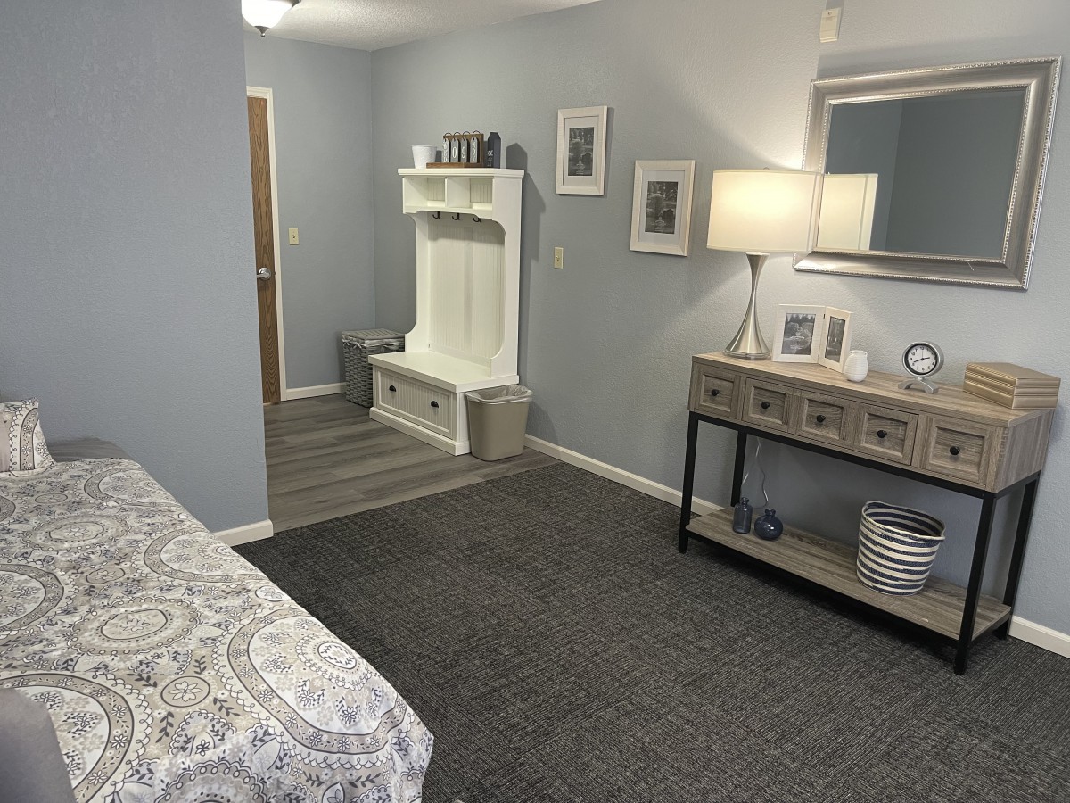 A modern, comfortable bedroom with stylish furniture and neutral tones.