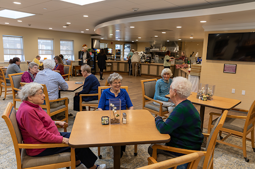 Seniors enjoying a social gathering in a communal dining area.