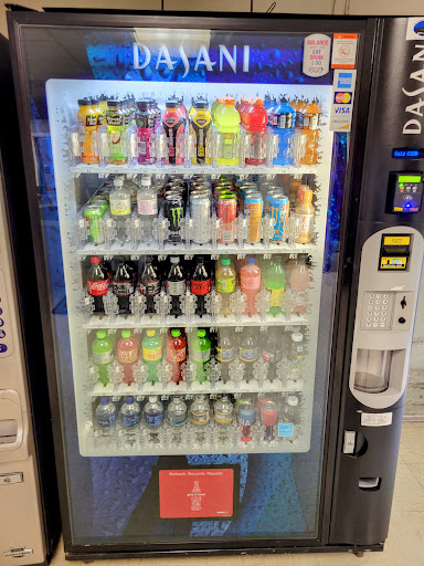 A vending machine filled with a colorful assortment of drinks.