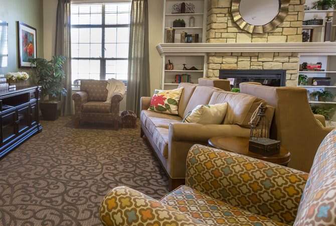 A cozy living room with comfortable seating and elegant decor.