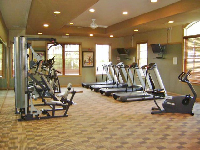 A well-equipped gym with treadmills and stationary bikes.