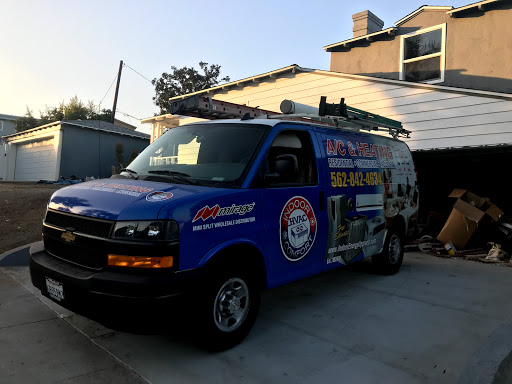 A blue service van parked in a residential area, showcasing its branding and logo.