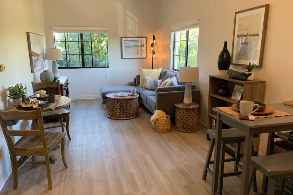 A cozy living room featuring a comfortable sofa, wooden coffee table, and stylish decor.
