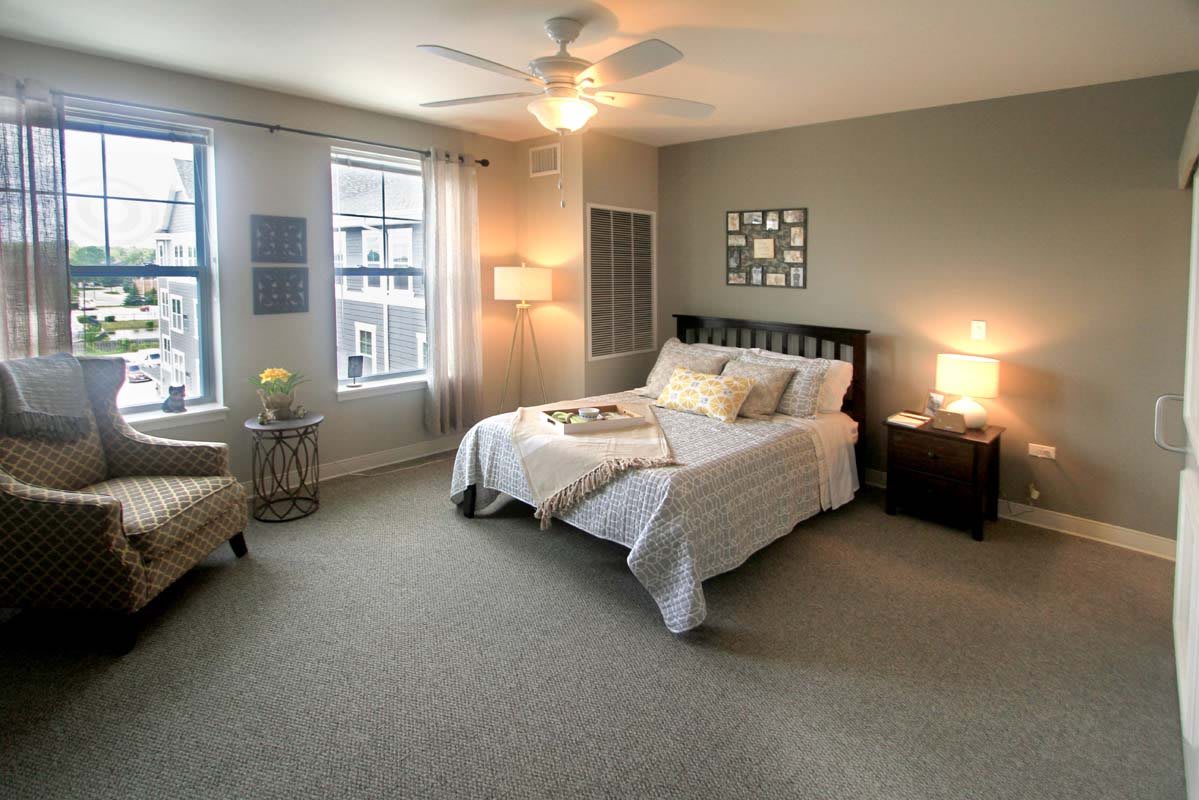 A modern and cozy bedroom with neutral colors and stylish decor.