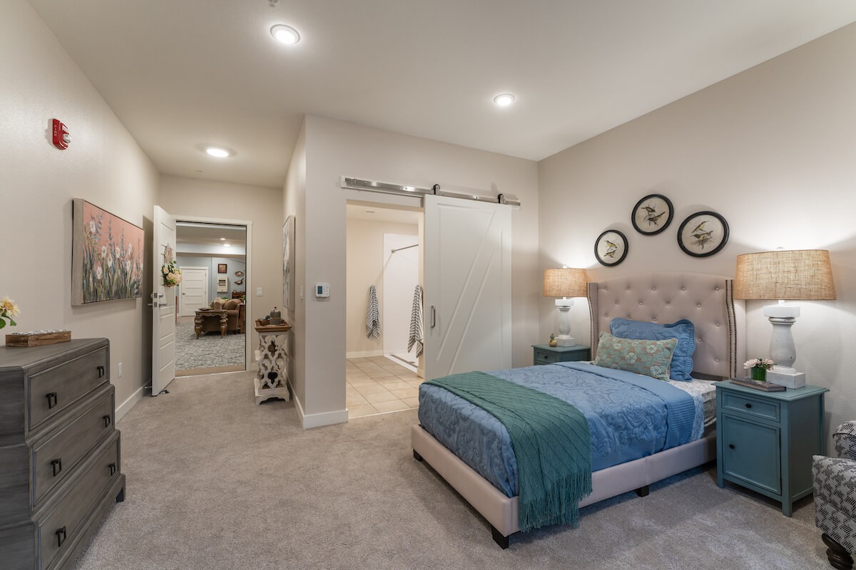 A modern bedroom with stylish decor and a comfortable bed.