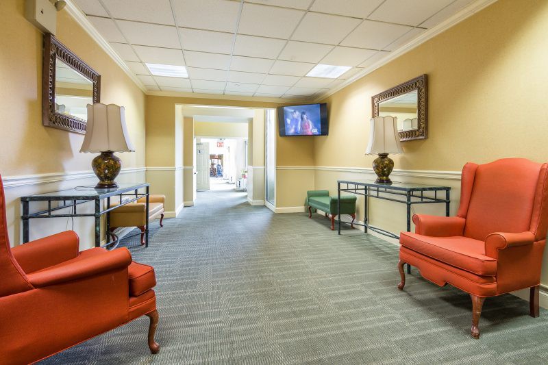 A spacious lobby area with comfortable seating and decorative elements.