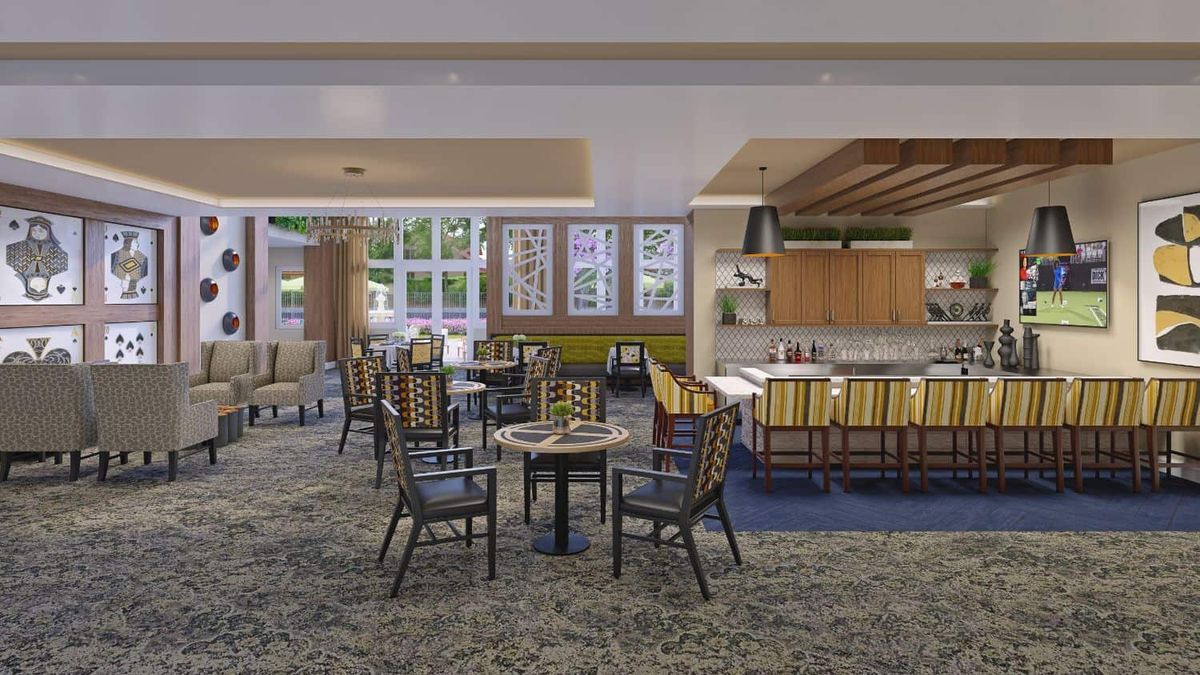 A modern dining area with comfortable seating and ample lighting.