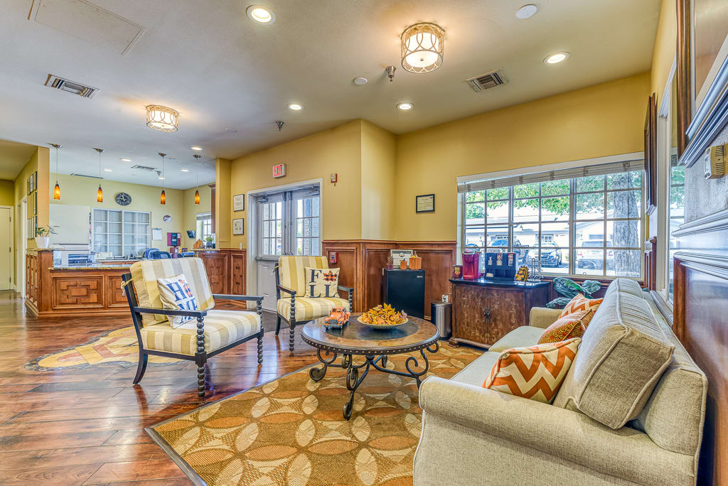 A cozy living room with comfortable seating and warm lighting.