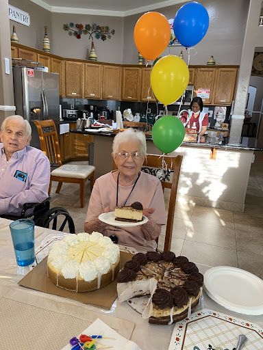 A joyful birthday celebration with delicious cakes and cheerful balloons.