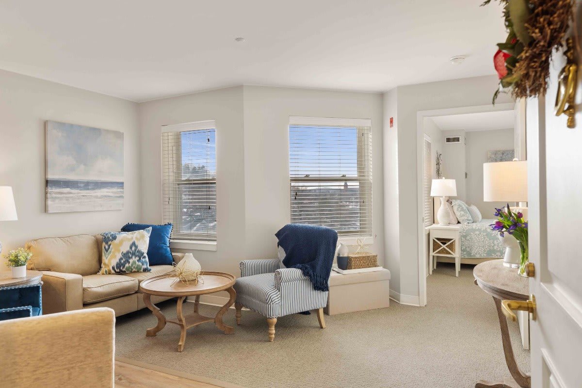 A cozy living room with light-colored decor and comfortable seating.