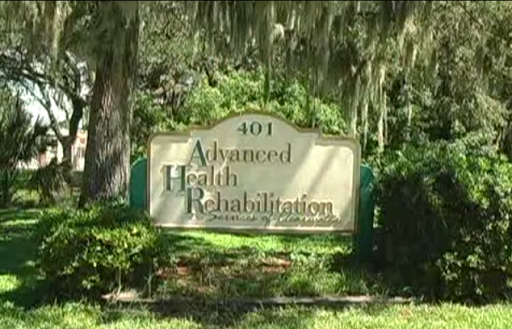 Sign for Advanced Health Rehabilitation located in a lush outdoor setting.