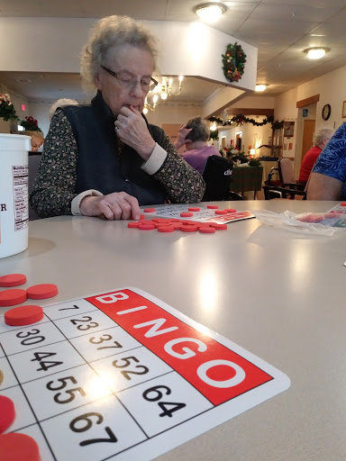 Seniors enjoying a game of Bingo at a community center.