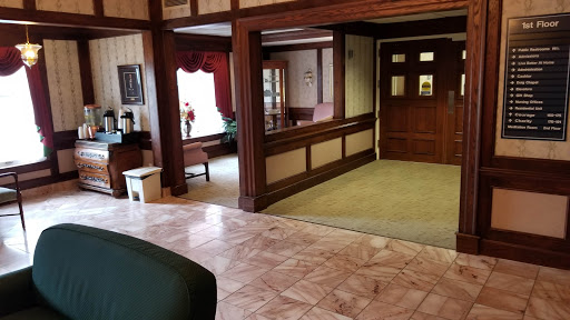 A cozy lobby area featuring wooden accents and a warm atmosphere.
