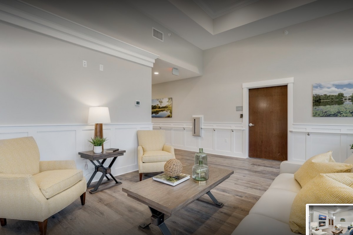 A modern living room with neutral colors, featuring comfortable seating and a stylish coffee table.