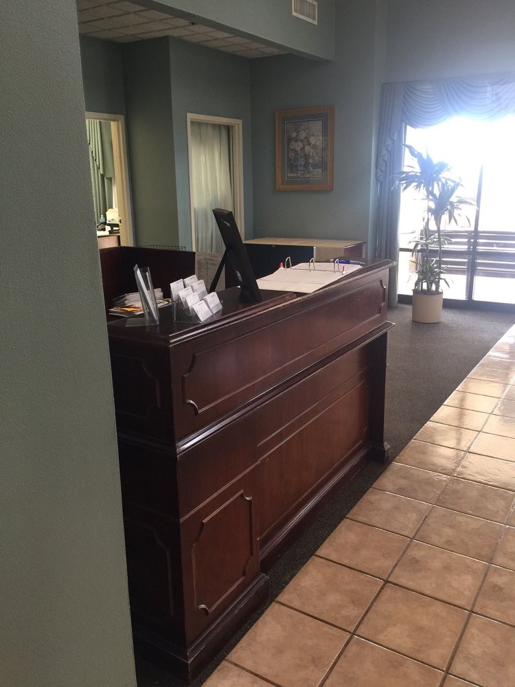 A reception desk in an office lobby area.
