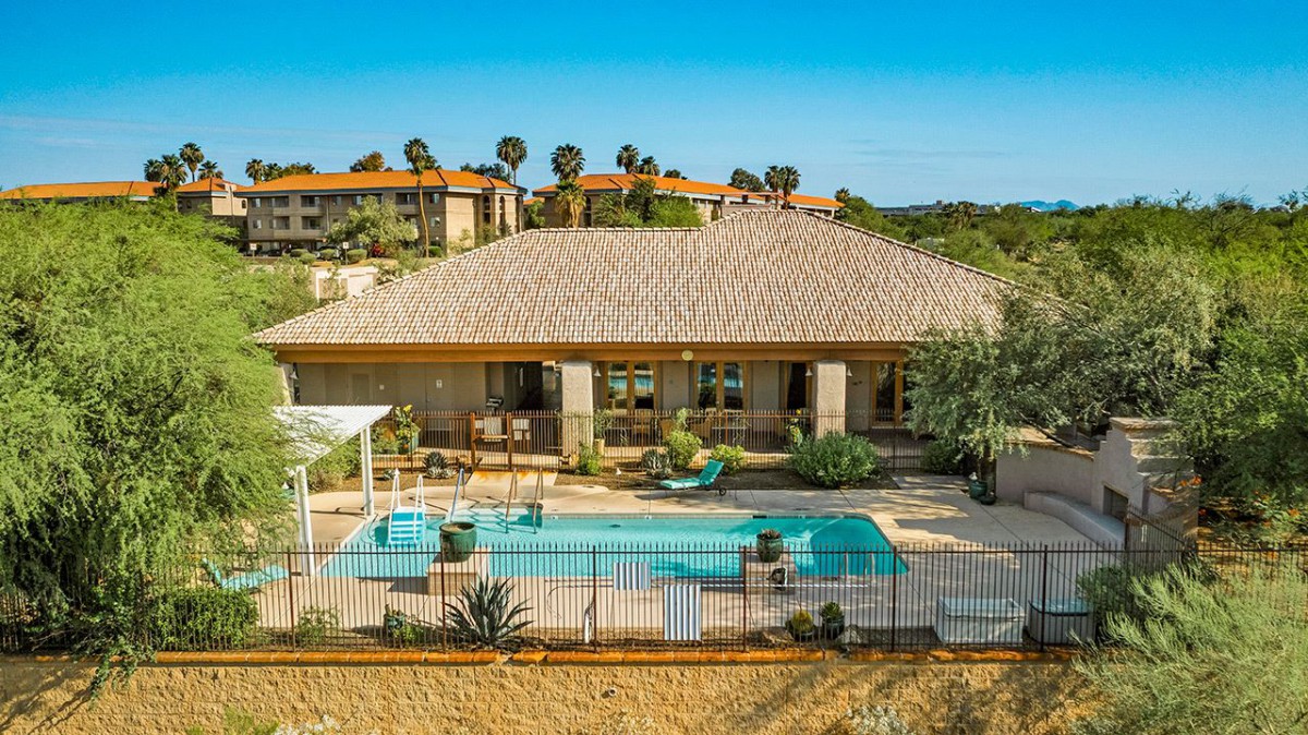 A beautiful vacation home with a swimming pool and garden.