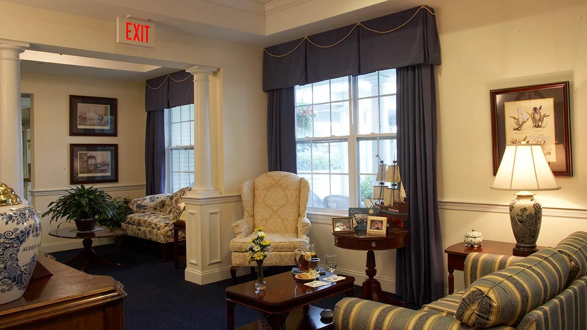 A cozy living room with elegant furniture and decor.