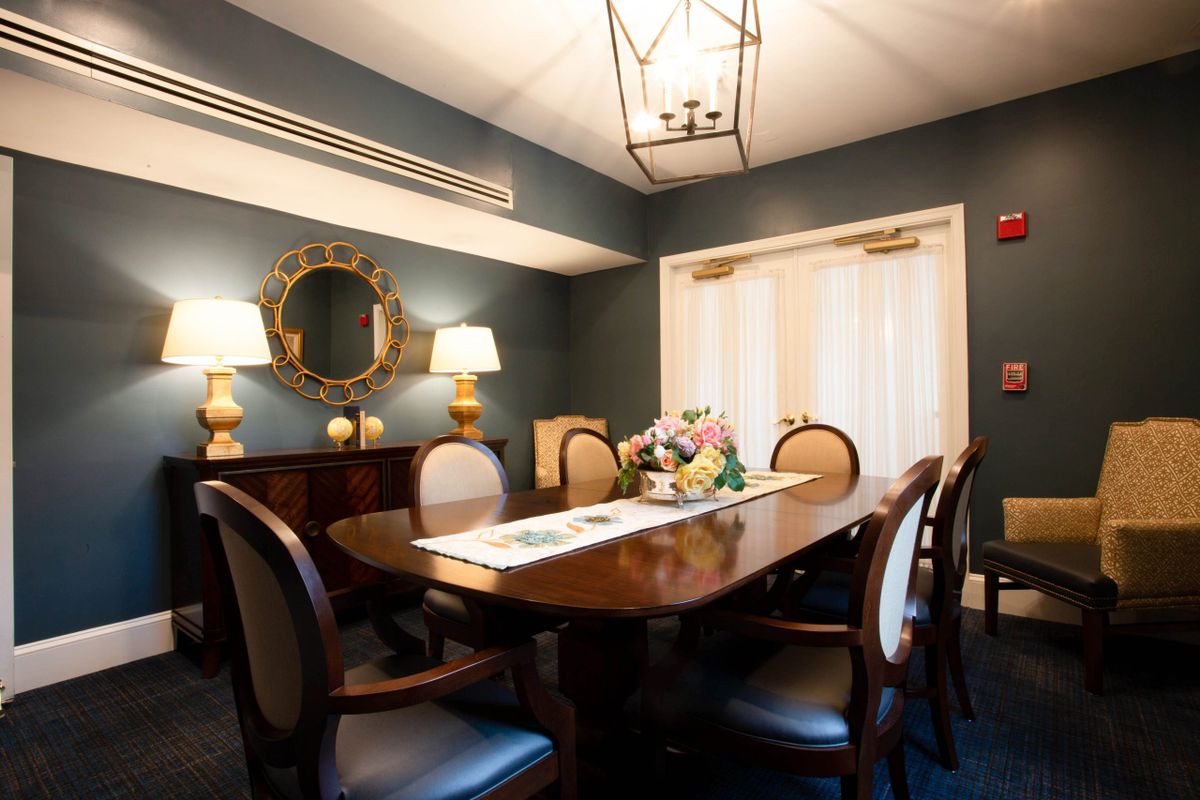 A classic dining room with elegant furniture and decor.