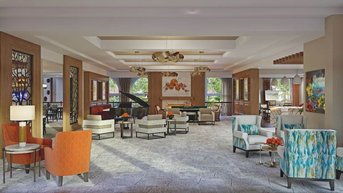 A luxurious hotel lobby with elegant seating and a grand piano.