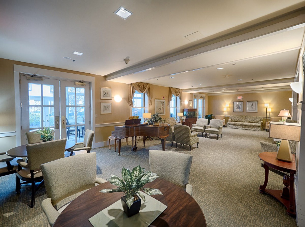 A spacious and elegantly decorated living area with comfortable seating and ambient lighting.