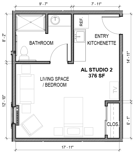 A floor plan of a studio apartment featuring a bathroom, kitchenette, and combined living and bedroom area.