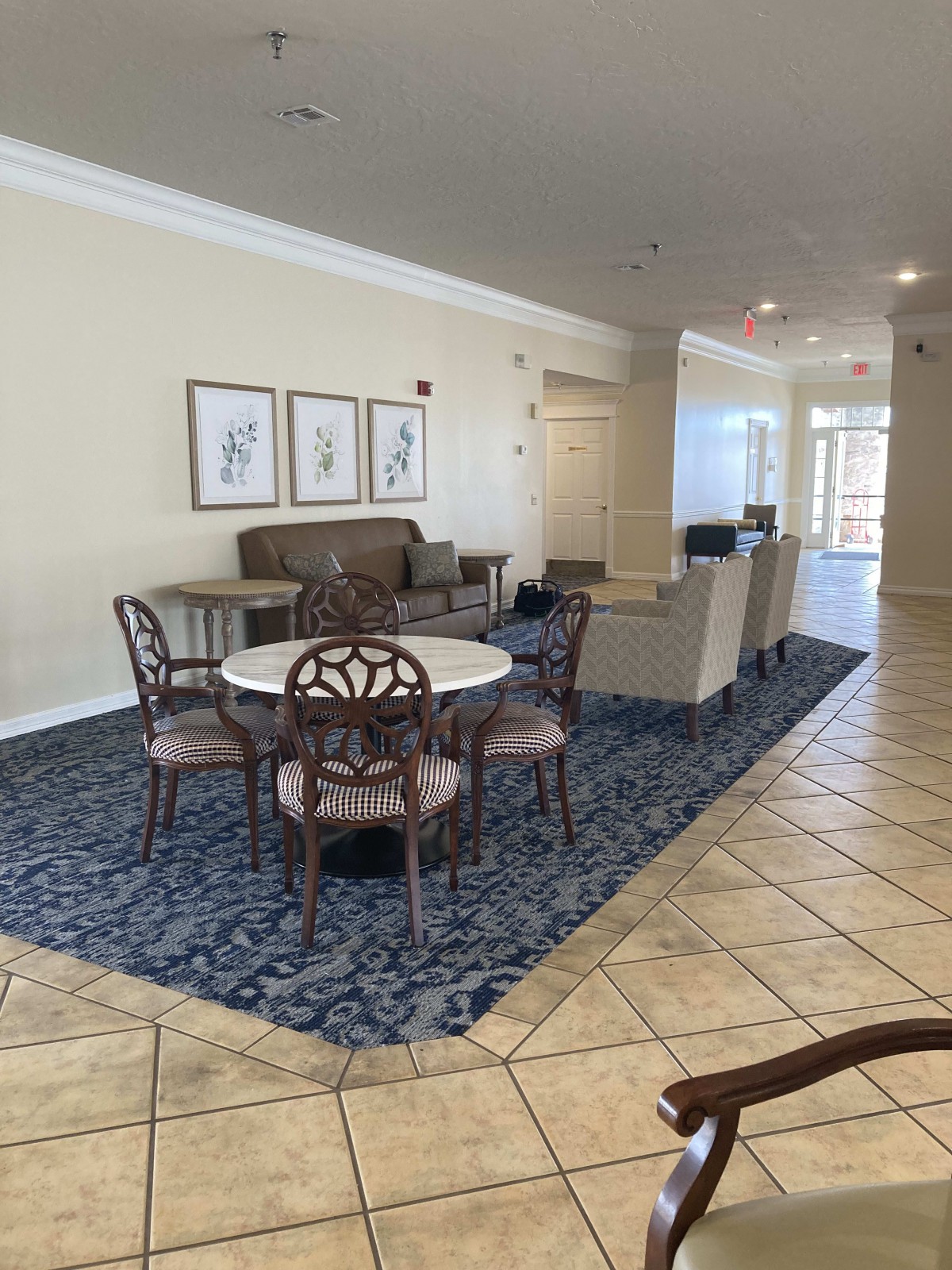 A spacious living and dining area with elegant furniture and decor.
