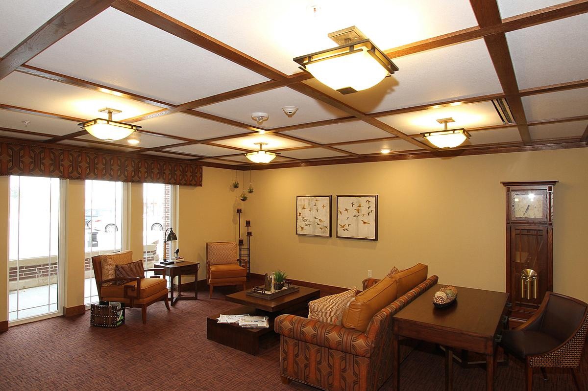 A cozy living room with comfortable seating and warm lighting.
