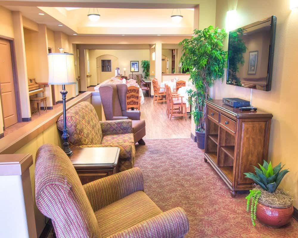 A cozy lobby with comfortable seating and warm lighting.
