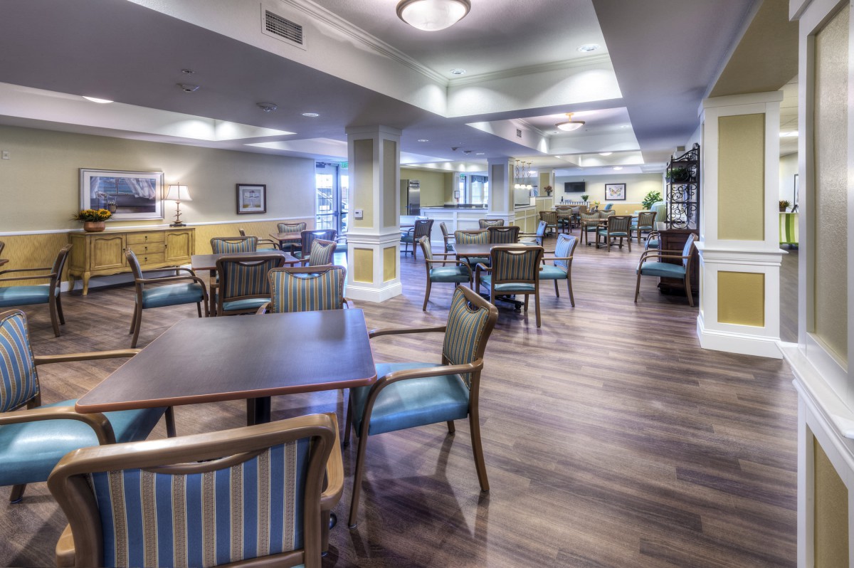 A spacious dining area with tables and chairs arranged neatly.