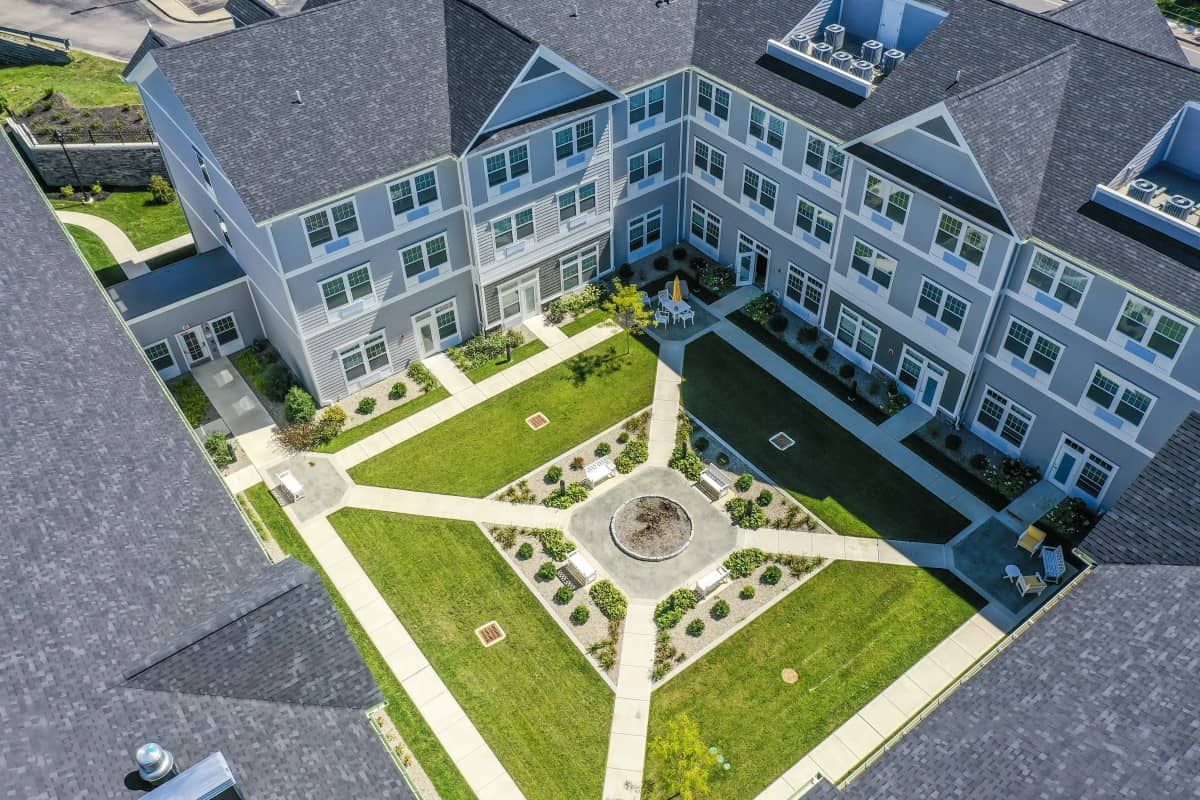 Aerial view of a landscaped courtyard within a residential apartment complex.