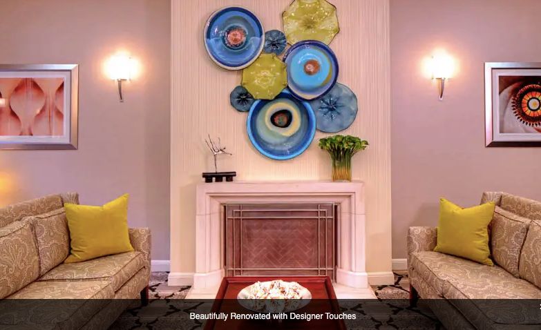 Stylish living room interior with colorful wall art and elegant decor.