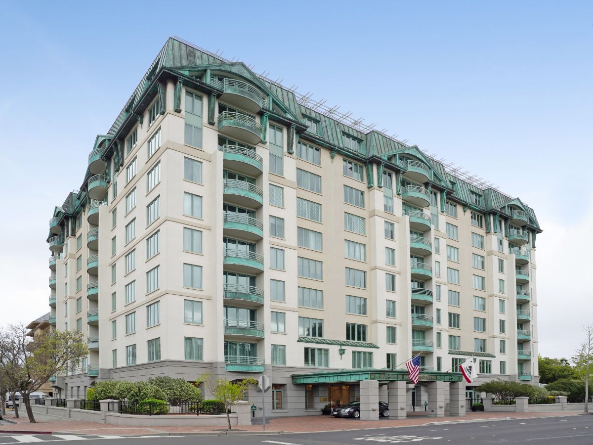 A modern apartment building with multiple floors and balconies.