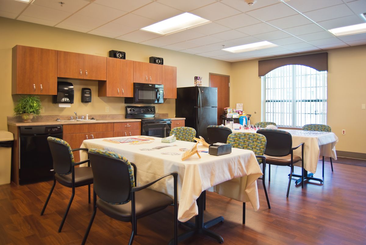 A cozy kitchen and dining area with a table set for a meal.