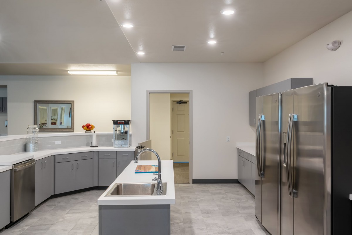 A modern kitchen with stainless steel appliances and sleek countertops.