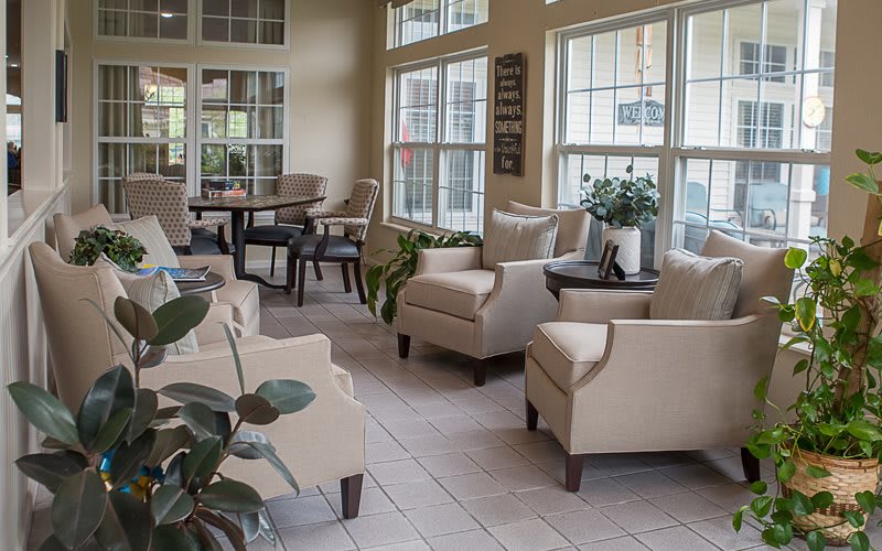 A bright and cozy living room with comfortable seating and abundant natural light.