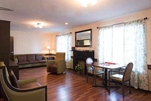 A cozy and inviting living room featuring comfortable seating and ample natural light.