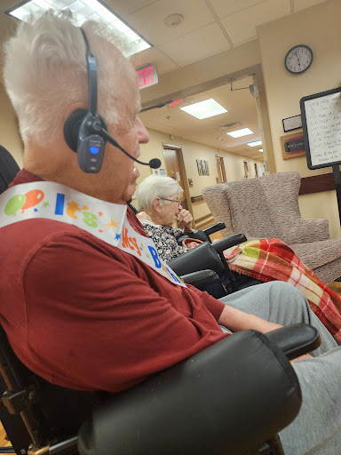 Elderly residents enjoying a moment of quiet reflection in a care facility.