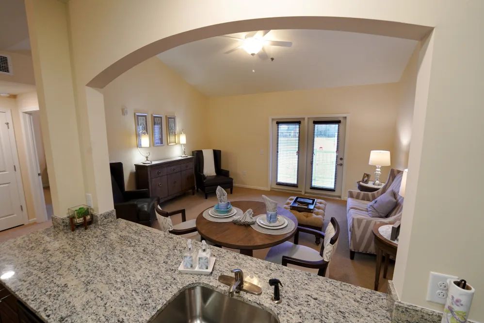 A cozy living and dining area with modern furniture in an open layout.