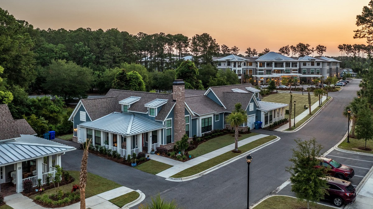 A peaceful suburban neighborhood with charming houses at sunset.