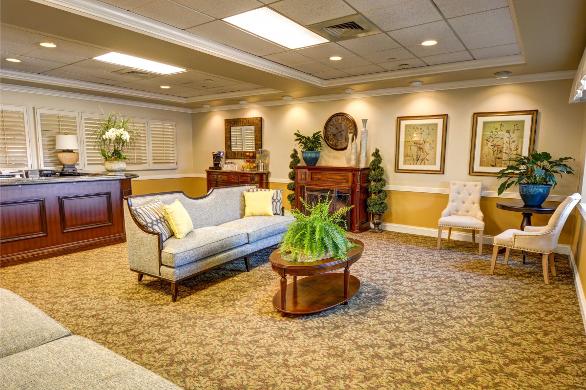 A cozy lobby area with a comfortable couch and elegant decor.