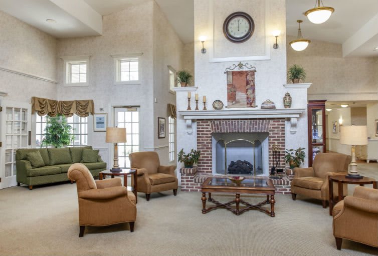 Spacious living room with a cozy fireplace and comfortable seating arrangement.